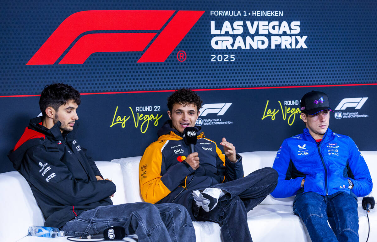 McLaren F1 Team driver Lando Norris, center, speaks while joined by Haas F1 Team driver Esteban ...