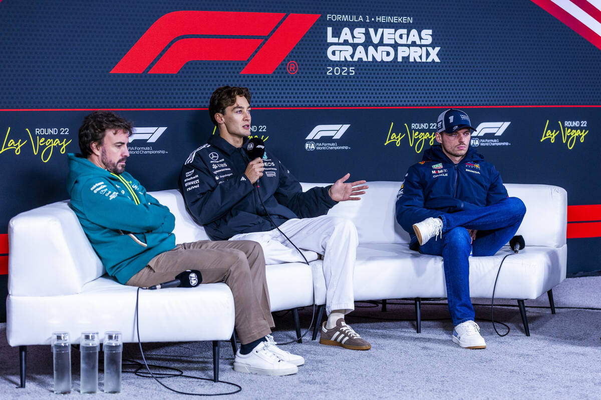 Mercedes F1 Team driver George Russell, center, speaks while joined by Aston Martin F1 Team dri ...