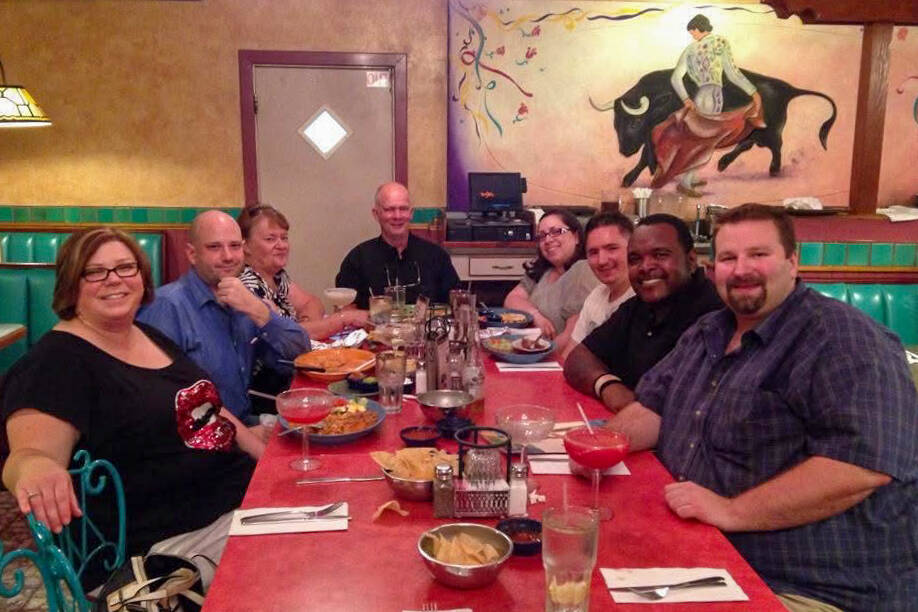 Sgt. Wesley Sterner, at the head of the table with loved ones in 2014. (Courtesy of Staci Groth)