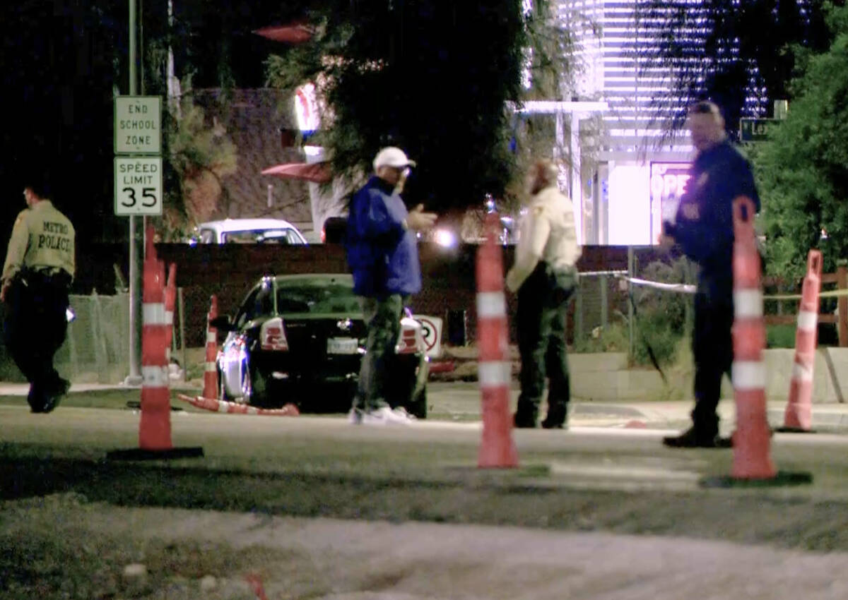 Las Vegas police investigate the scene of an accident where an 11-year-old girl was struck and ...