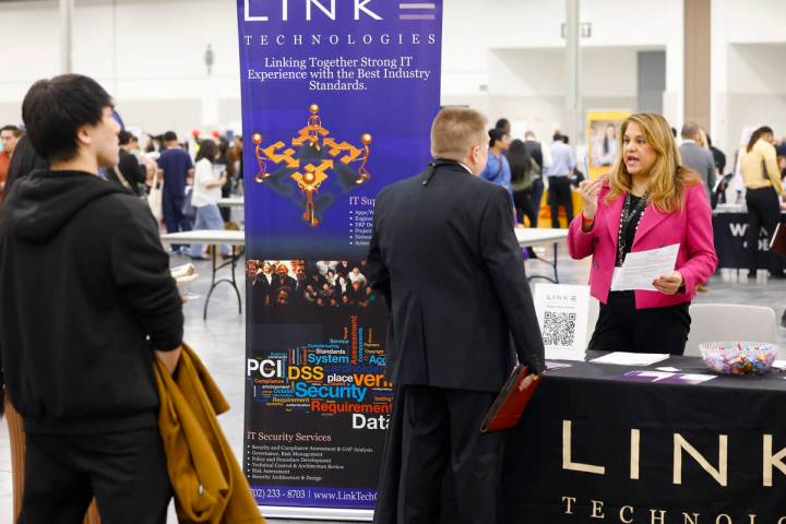 Ishana Lennard, right, a technical recruiter at Link Technologies, talks to a job seeker during ...