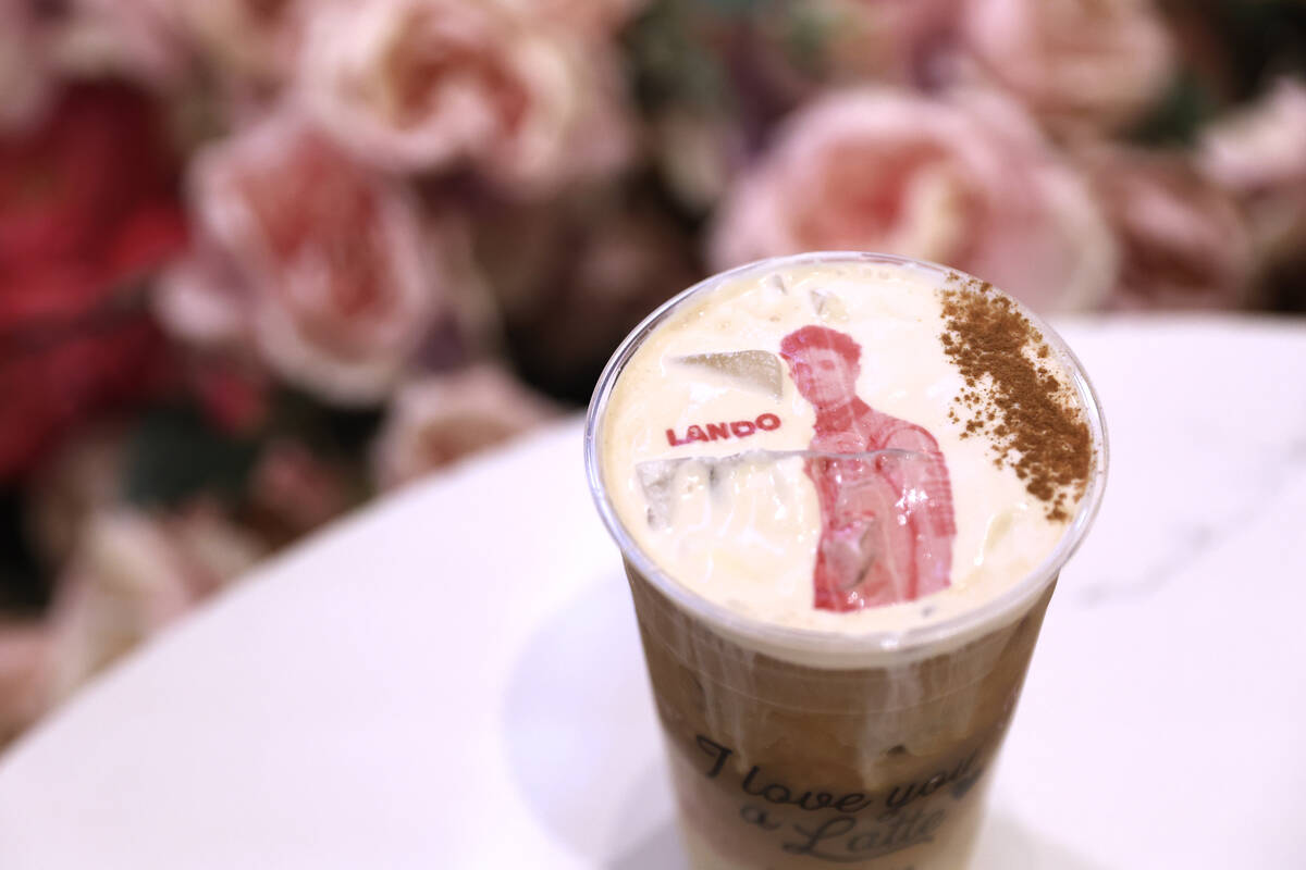An iced latte featuring the likeness of F1 driver Lando Norris is served at Cafe Lola in the Fo ...
