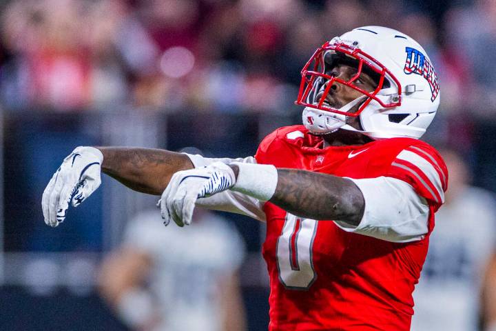 UNLV wide receiver Troy Omeire (0) celebrates another long catch over Utah State during the sec ...