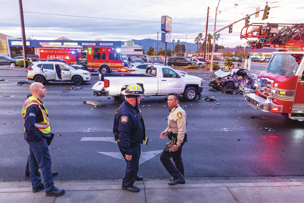 Metropolitan Police officers work with Las Vegas and North Las Vegas firefighters as numerous v ...