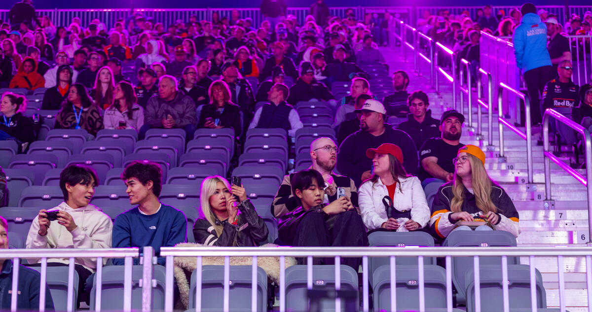 A moderate sized crowd looks on during the first practice round at the Las Vegas Grand Prix on ...