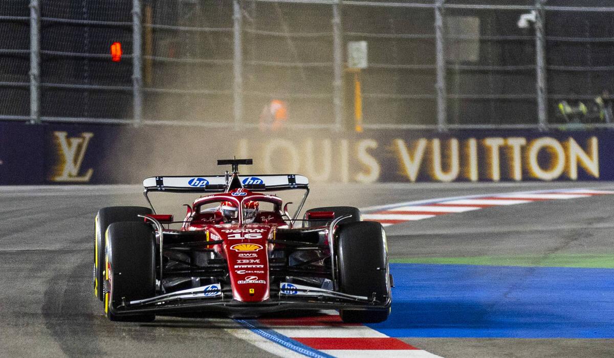 Ferrari driver Charles Leclerc (16) navigates the final turn during the second practice round a ...