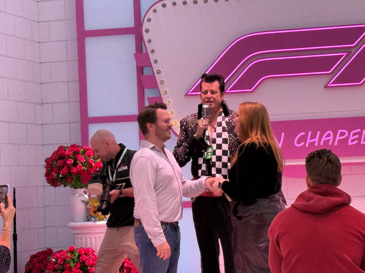Tim and Olivia Wooten, from London, England, renew their vows with an Elvis impersonator, at th ...