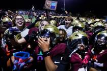 Faith Lutheran players celebrate after defeating Centennial in a Class 5A Southern Region title ...