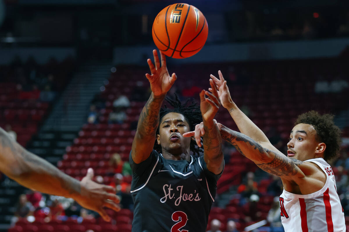 St. Joseph guard Deuce Jones II (2) passes to a teammate during the first half of the game on T ...