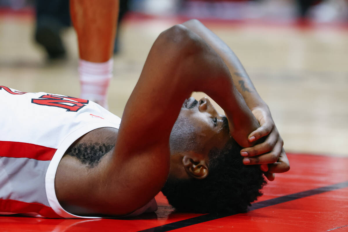 UNLV forward Kimani Hamilton (2) lies on the court during the first half of the game on Thursda ...