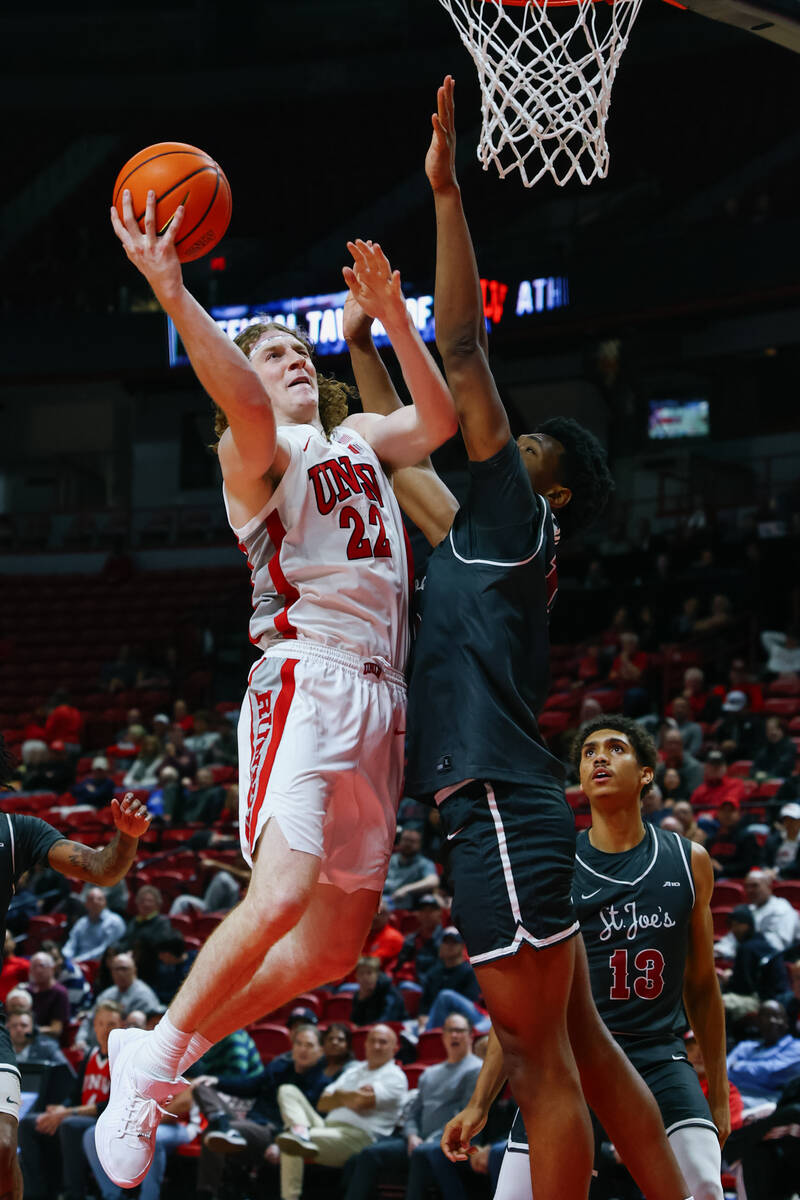 UNLV forward Walter Brown (22) leaps up to take a shot during the second half of the game on Th ...