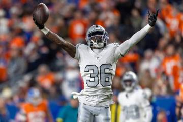 Raiders cornerback Kyu Blu Kelly (36) celebrates his interception of a pass intended for Denver ...