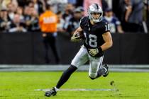 Raiders wide receiver Jack Bech (18) makes a catch during the first half of an NFL game against ...