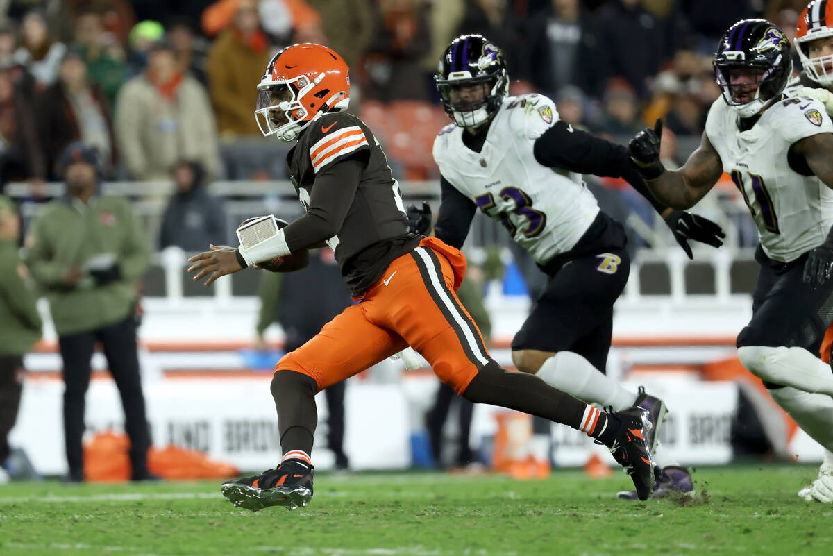 Cleveland Browns quarterback Shedeur Sanders (12) runs with the ball during an NFL football gam ...