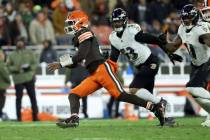 Cleveland Browns quarterback Shedeur Sanders (12) runs with the ball during an NFL football gam ...