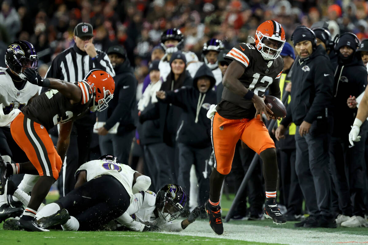 Cleveland Browns quarterback Shedeur Sanders (12) runs with the ball during an NFL football gam ...