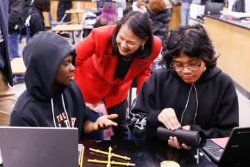 Superintendent Jhone Ebert chats with Cheyenne High School students Jamari Fields, left, and Ja ...
