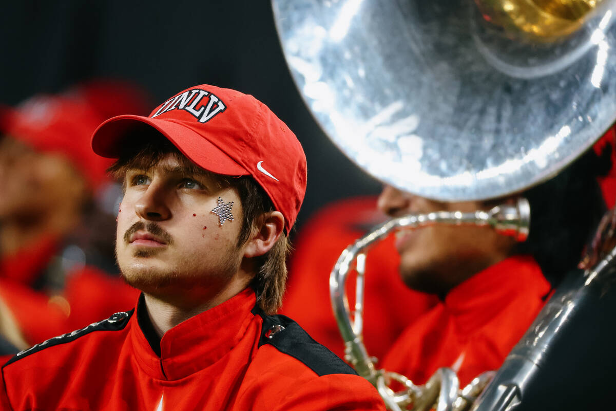 A UNLV marching band member watches the game from the sidelines just before the end of the firs ...