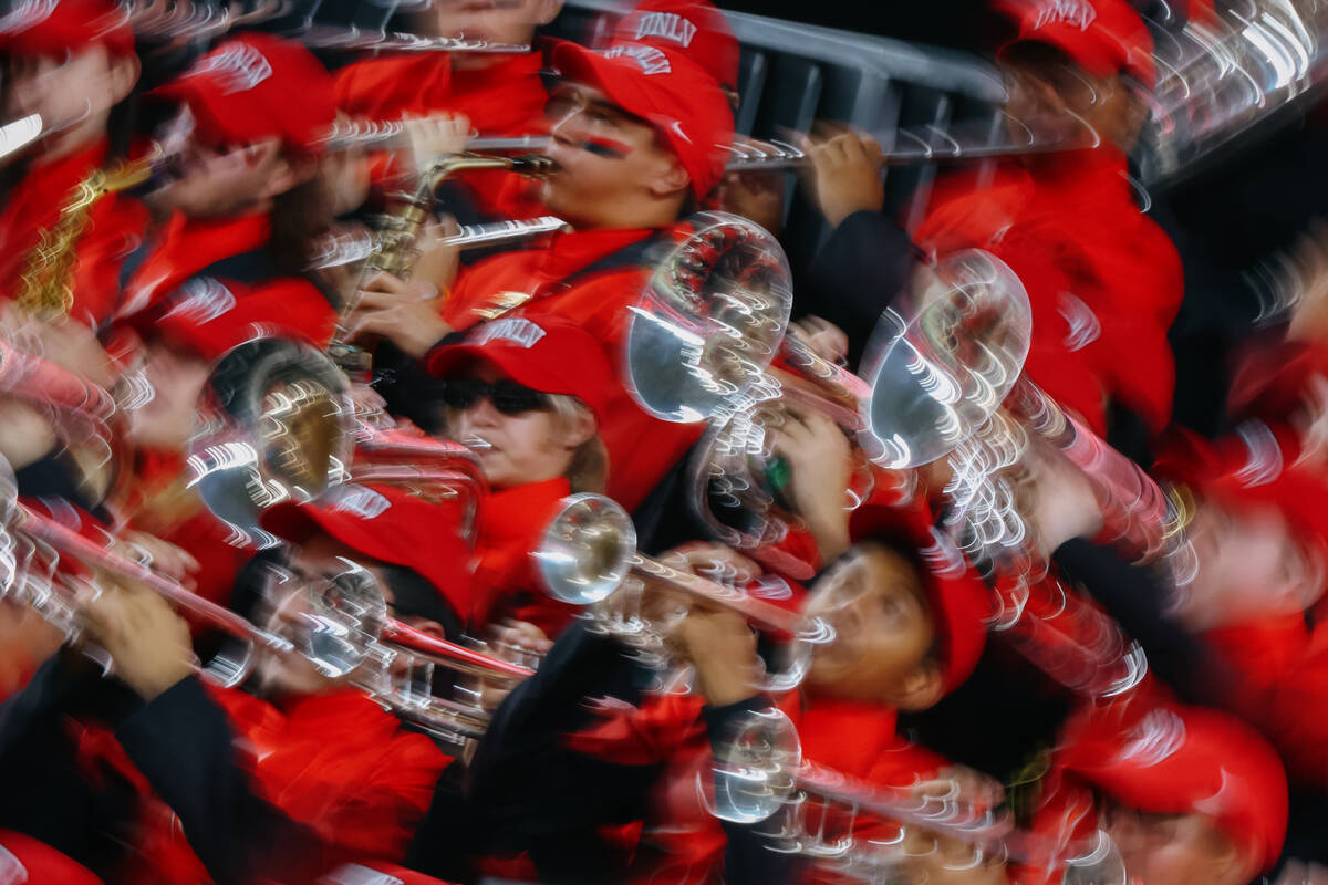 The UNLV marching band plays during the second half of the Ninth Island Showdown game on Friday ...