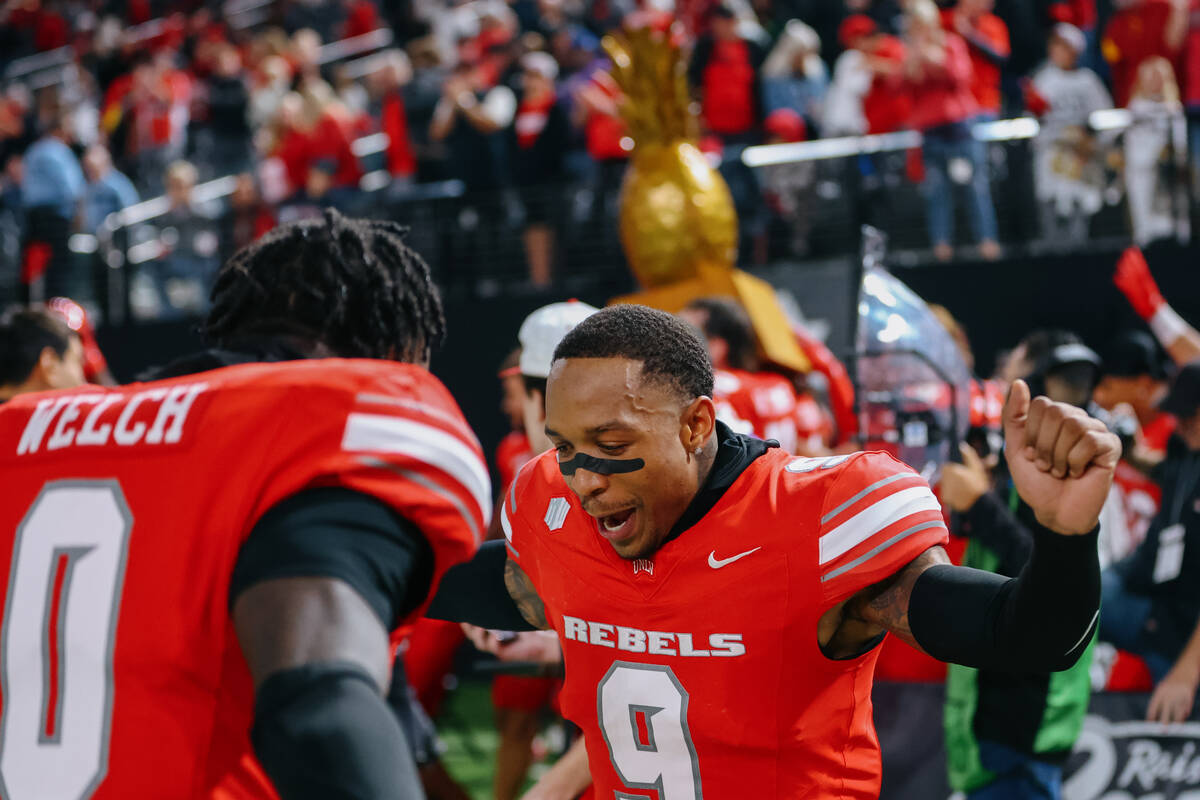 UNLV defensive back Aamaris Brown (9) celebrates the Rebels’ win over Hawaii with teamma ...