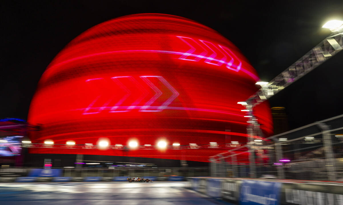 Ferrari driver Lewis Hamilton (44) passes by the Sphere during practice 3 at the Las Vegas Gran ...