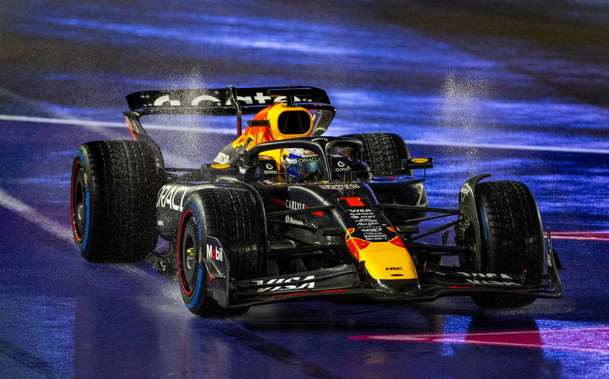 Red Bull driver Max Verstappen (1) overshoots turn 1 in the rain during the qualifying race at ...