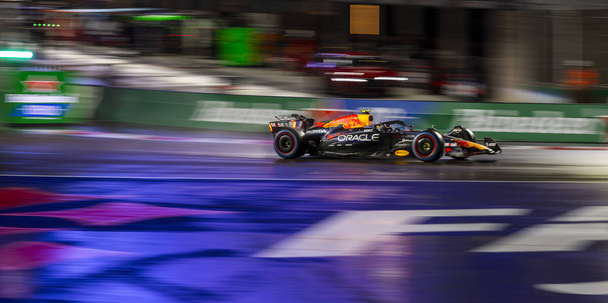 Red Bull driver Max Verstappen (1) navigates turn 1 in the rain during the qualifying race at t ...