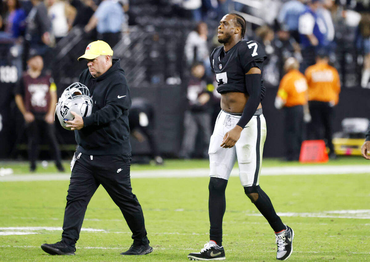 Raiders quarterback Geno Smith (7) walks off the field after losing to Dallas Cowboys durinh an ...