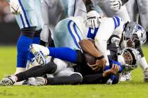 Dallas Cowboys defensive tackle Quinnen Williams (92) sacks Raiders quarterback Geno Smith (7) ...