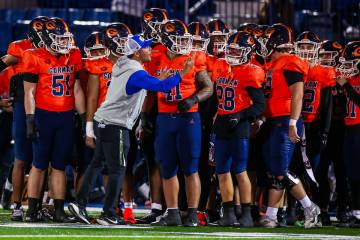 Bishop Gorman head coach Brent Browner directs his team during a Open Division high school foot ...