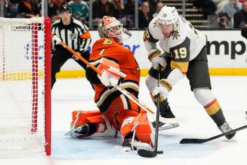 Vegas Golden Knights right wing Reilly Smith, right, tries to get a shot past Anaheim Ducks goa ...