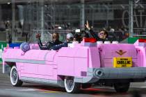 Actor Terry Crews drives a Lego Cadillac with race winner Red Bull driver Max Verstappen (1), s ...