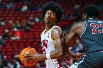 UNLV forward Jacob Bannarbie (10) breathes deep as he pivots around St. Joseph center Justice A ...