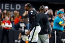 Raiders quarterback Geno Smith (7) argues with coaching staff as he leaves the field during an ...
