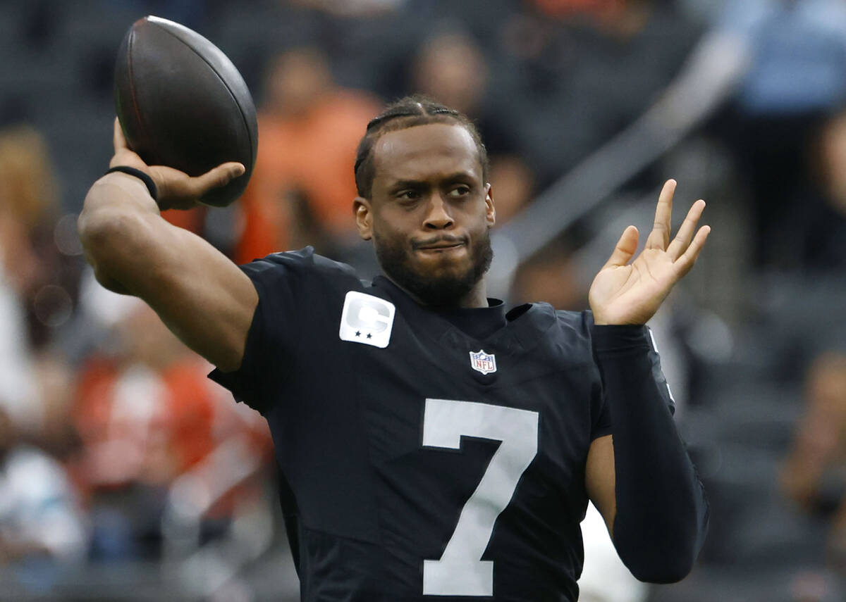 Raiders quarterback Geno Smith (7) throws a pass during a warm up before an NFL football game a ...
