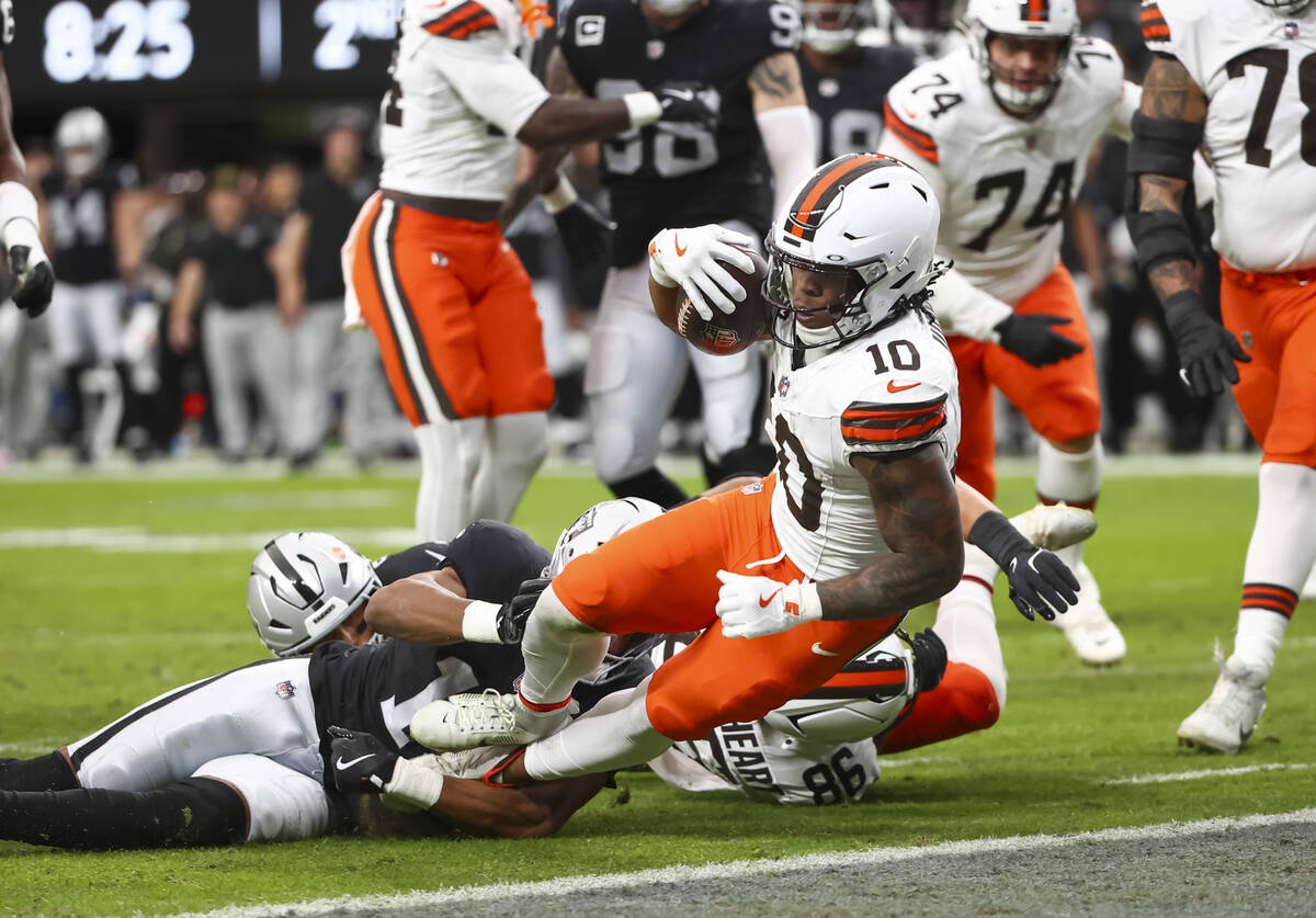 Cleveland Browns running back Quinshon Judkins (10) scores a touchdown against the Raiders duri ...