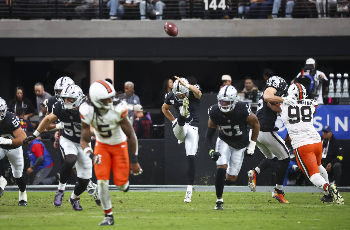 Raiders punter AJ Cole (6) punts the ball during the first half of an NFL game against the Clev ...