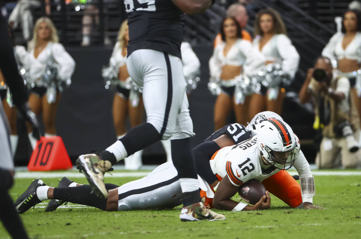 Cleveland Browns quarterback Shedeur Sanders (12) gets sacked by Raiders defensive end Malcolm ...