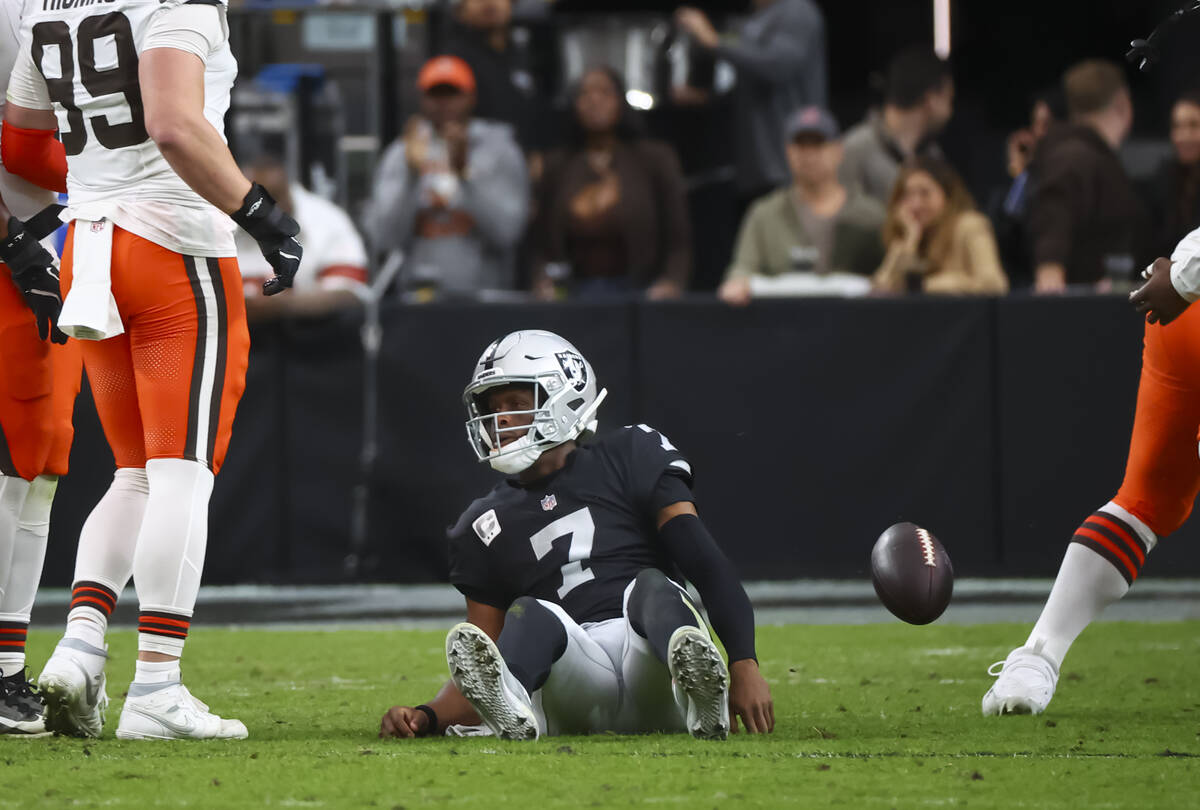 Raiders quarterback Geno Smith (7) looks on after getting sacked by the Cleveland Browns during ...