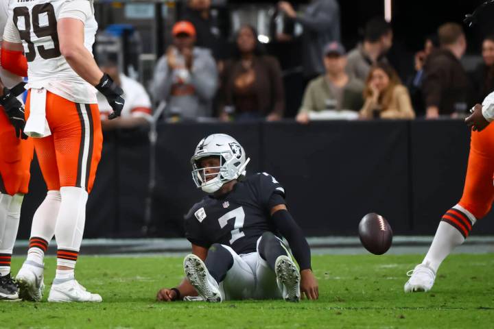 Raiders quarterback Geno Smith (7) looks on after getting sacked by the Cleveland Browns during ...
