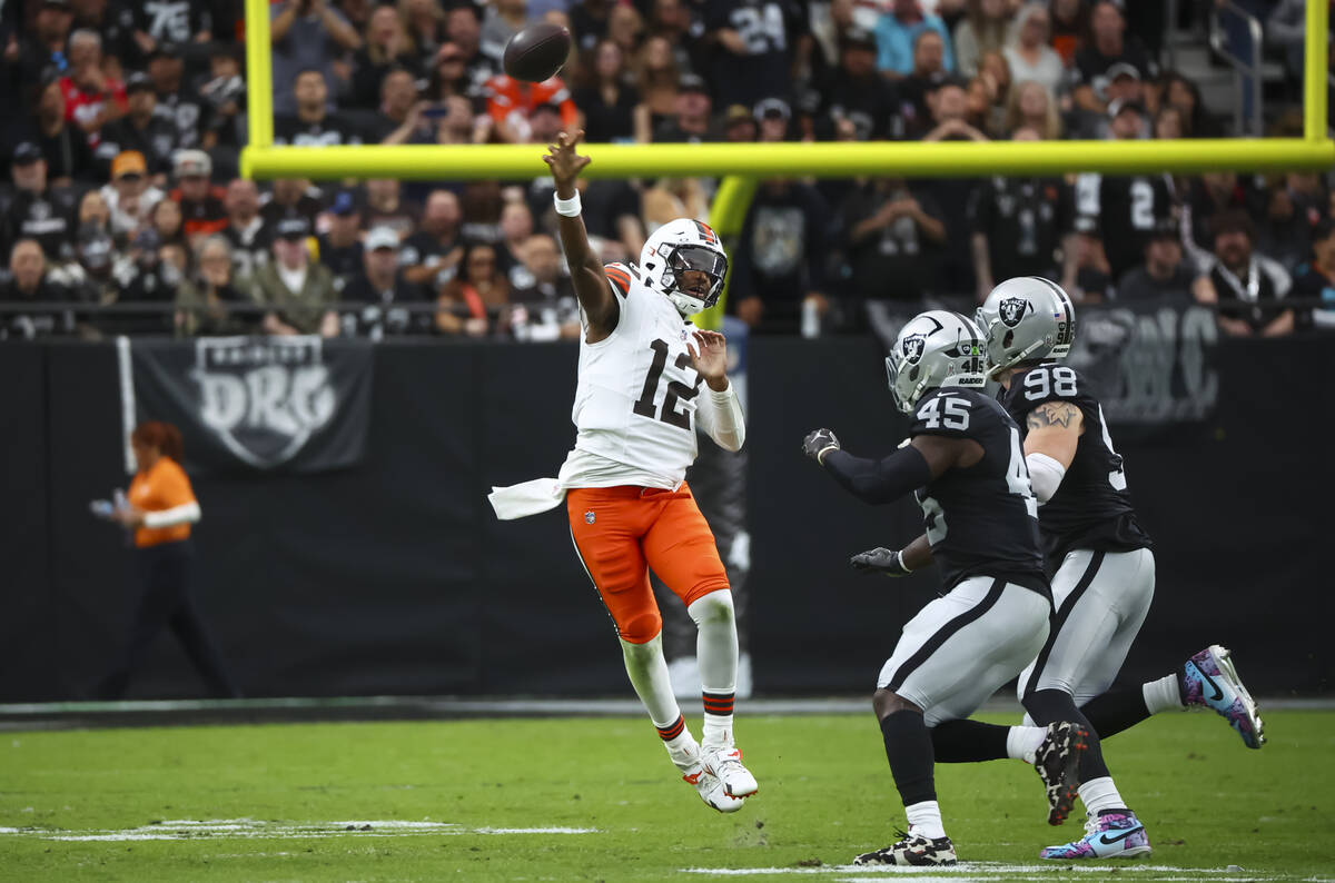 Cleveland Browns quarterback Shedeur Sanders (12) throws a pass under pressure from Raiders lin ...