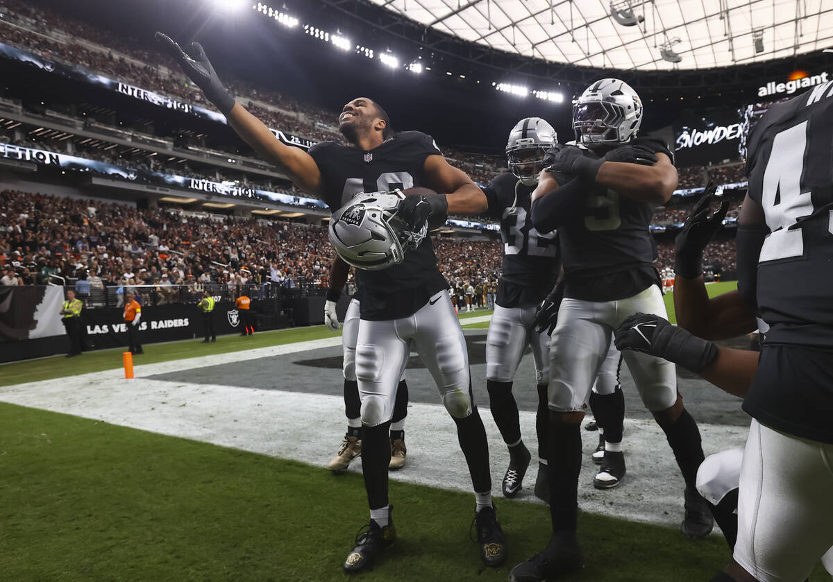 Raiders defensive end Charles Snowden (49) celebrates his interception against the Cleveland Br ...