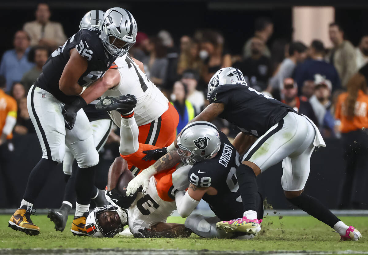 Raiders defensive end Maxx Crosby (98) tackles Cleveland Browns running back Jerome Ford (34) d ...