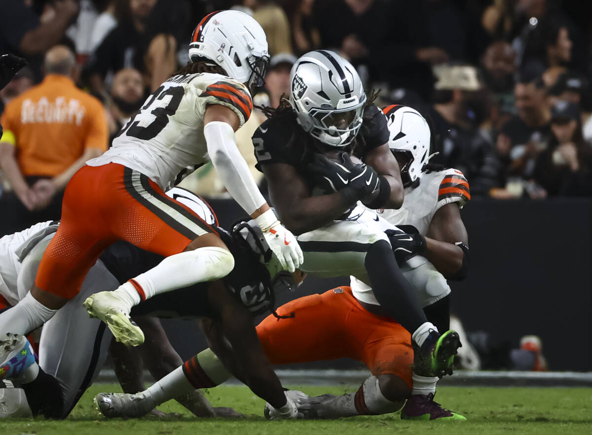 Raiders running back Ashton Jeanty (2) runs the ball during the second half of an NFL game agai ...