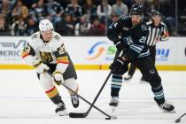 Vegas Golden Knights left wing Cole Reinhardt (23) and Utah Mammoth center Jack McBain (22) bat ...