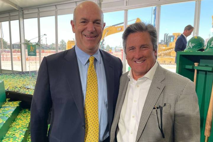 MGM Resorts International President and CEO Bill Hornbuckle is shown with Athletics owner John ...