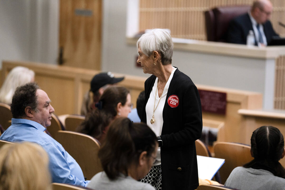 A community member returns to their seat after making a public comment regarding the possible c ...