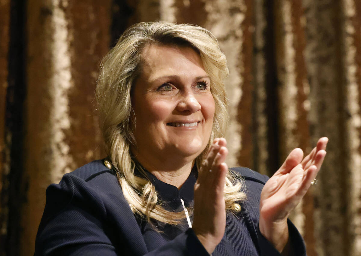 Henderson Councilwoman Carrie Cox applauds as Henderson Mayor Michelle Romero delivers the Stat ...