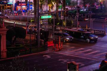 Cars pass through the previously closed off Formula One circuit on the Strip Sunday, Nov. 23, 2 ...