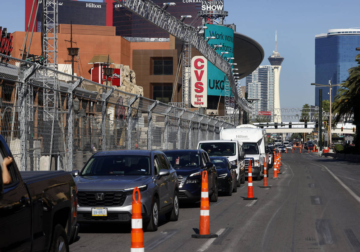 Commuters are directed into a single lane on the Strip as workers are in the process of dismant ...
